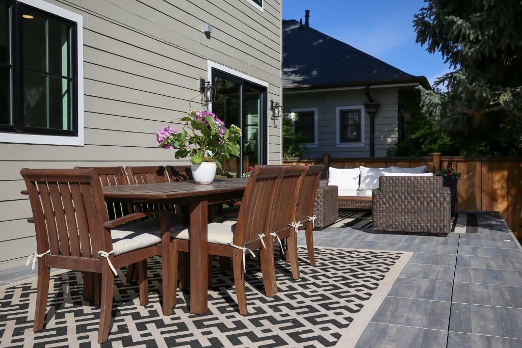 Backyard makeover elevated patio porcelain pavers