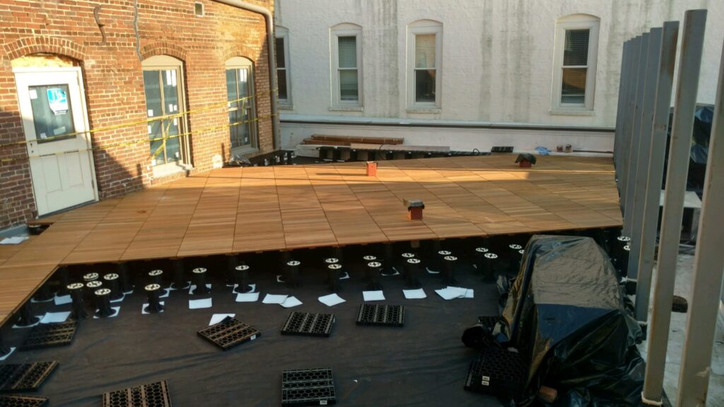 Rooftop deck installation using the Stonedeks system to combine materials for a safe and enjoyable rooftop deck