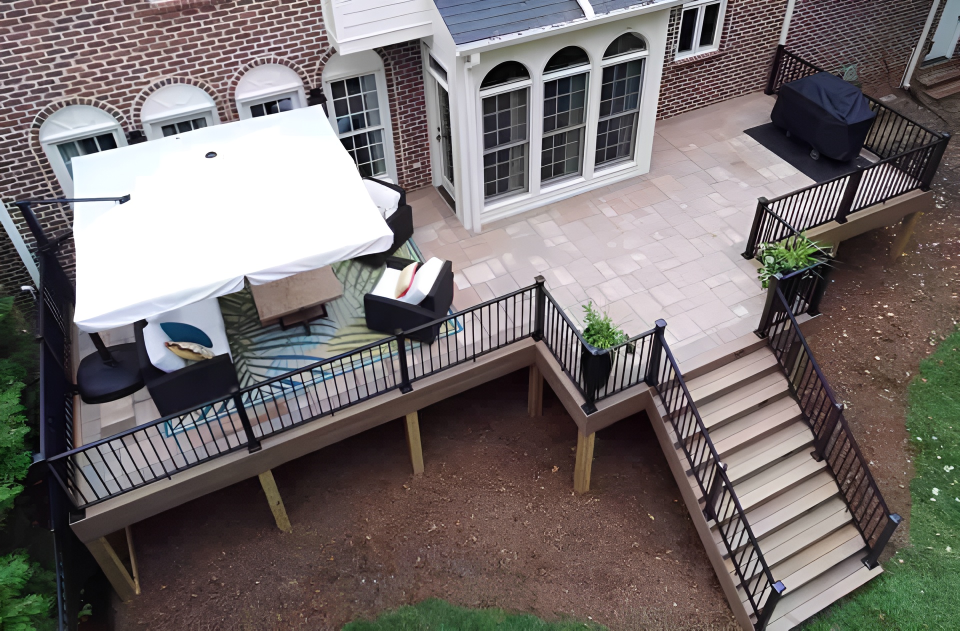 Elevated Decks - https://stonedeks.com/wp-content/uploads/2025/01/Majestic-Elevated-Stone-Deck-with-StoneDeks-system-upscaled.jpg