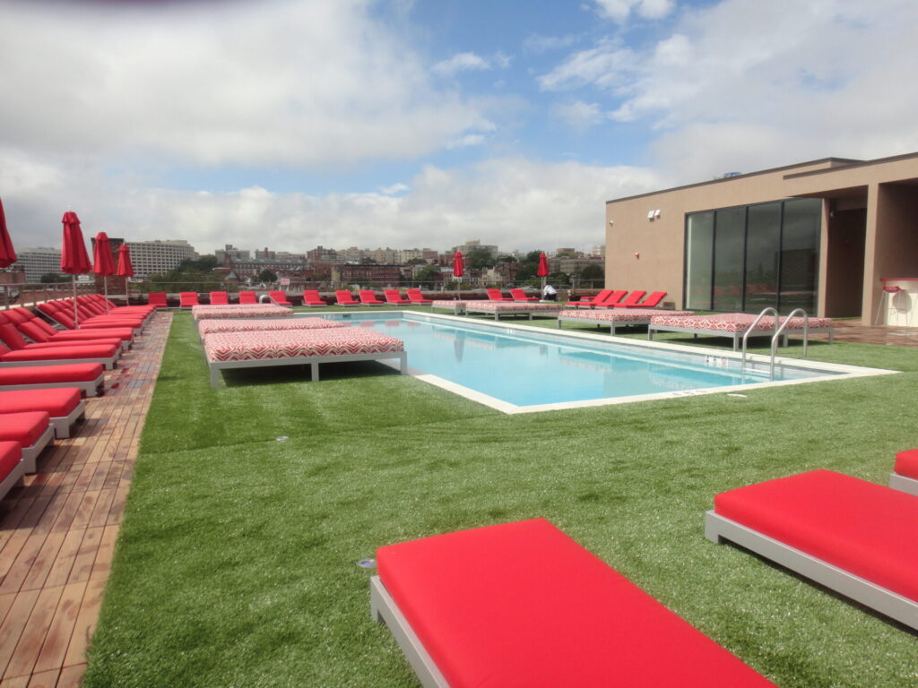 Rooftop deck using mixed materials of tile and turf. StoneDeks systems create safe and reliable rooftop living spaces